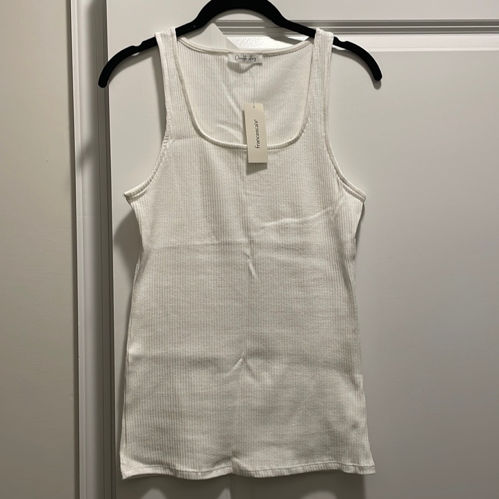 Charlotte Avery; size L but runs small so fits like a medium; color is off white